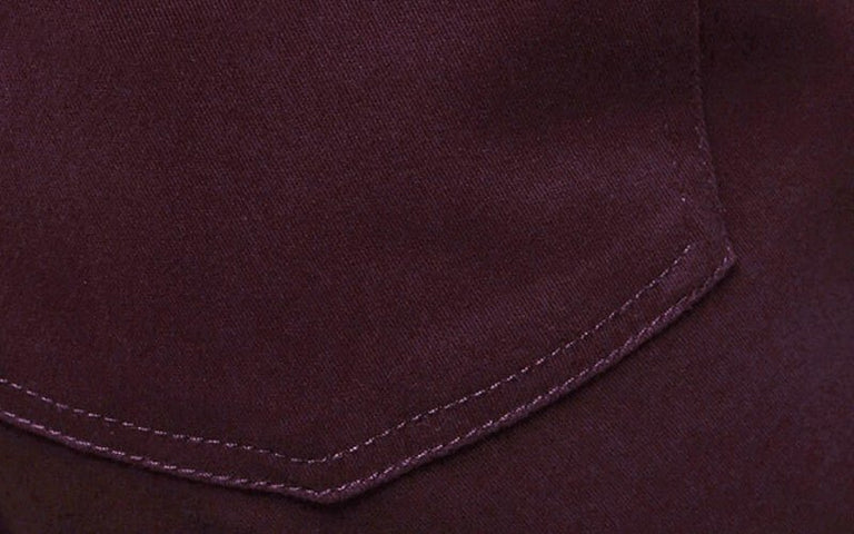 Close up of seam on dark purple item of clothing
