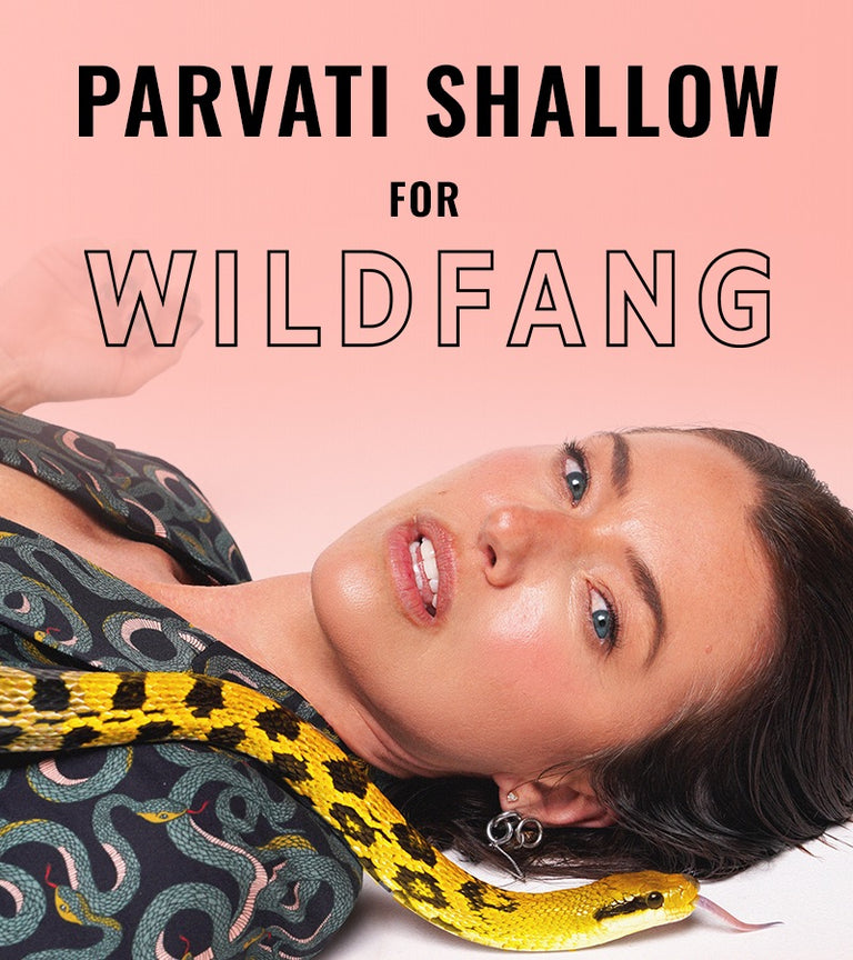 On gradient peach colored background, close up image of Parvati Shallow with snake and text above her that says PARVATI SHALLOW FOR WILDFANG