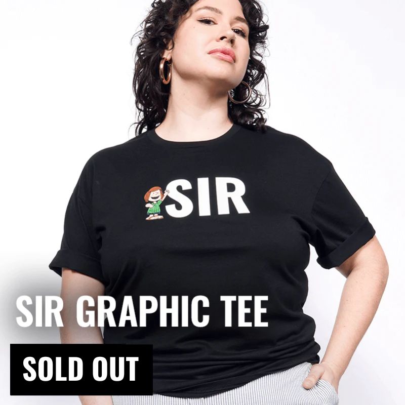 Person wearing The Peanuts x Wildfang SIR graphic t shirt with text overlay that reads "SIR Graphic Tee Sold out"