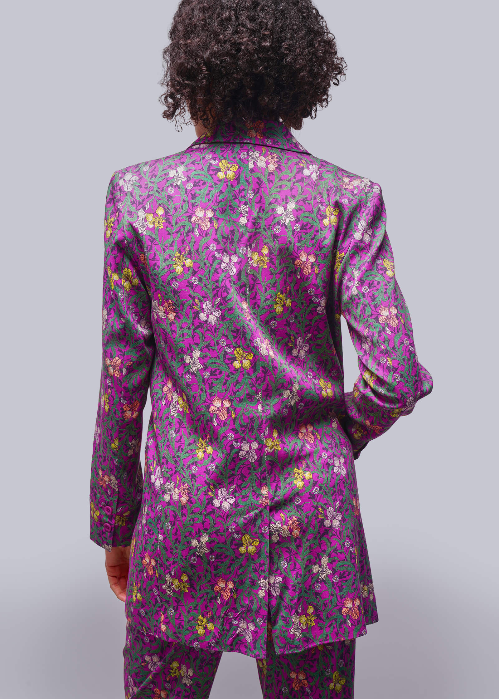 S=Pictured from back, model wears purple tones floral blazer and matching pant