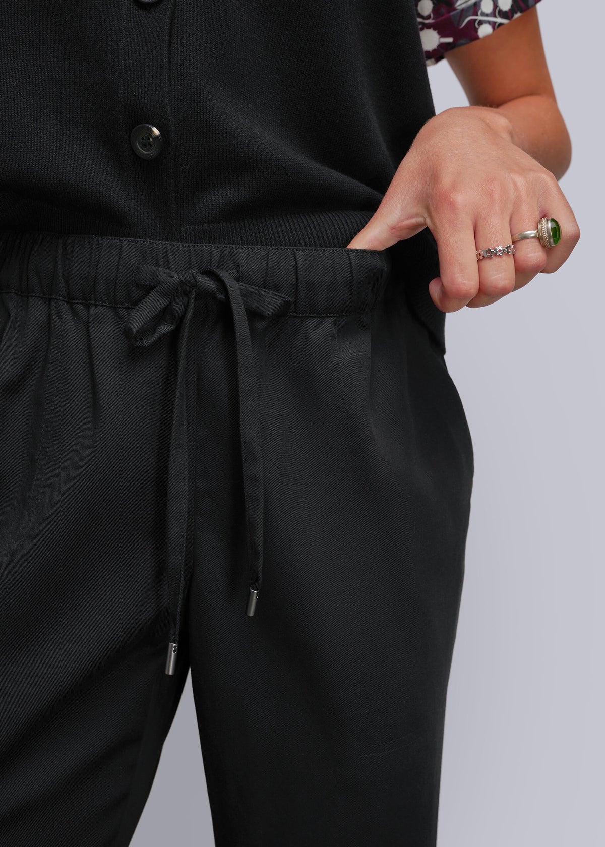 S=Close up of drawstring waistband on black pant