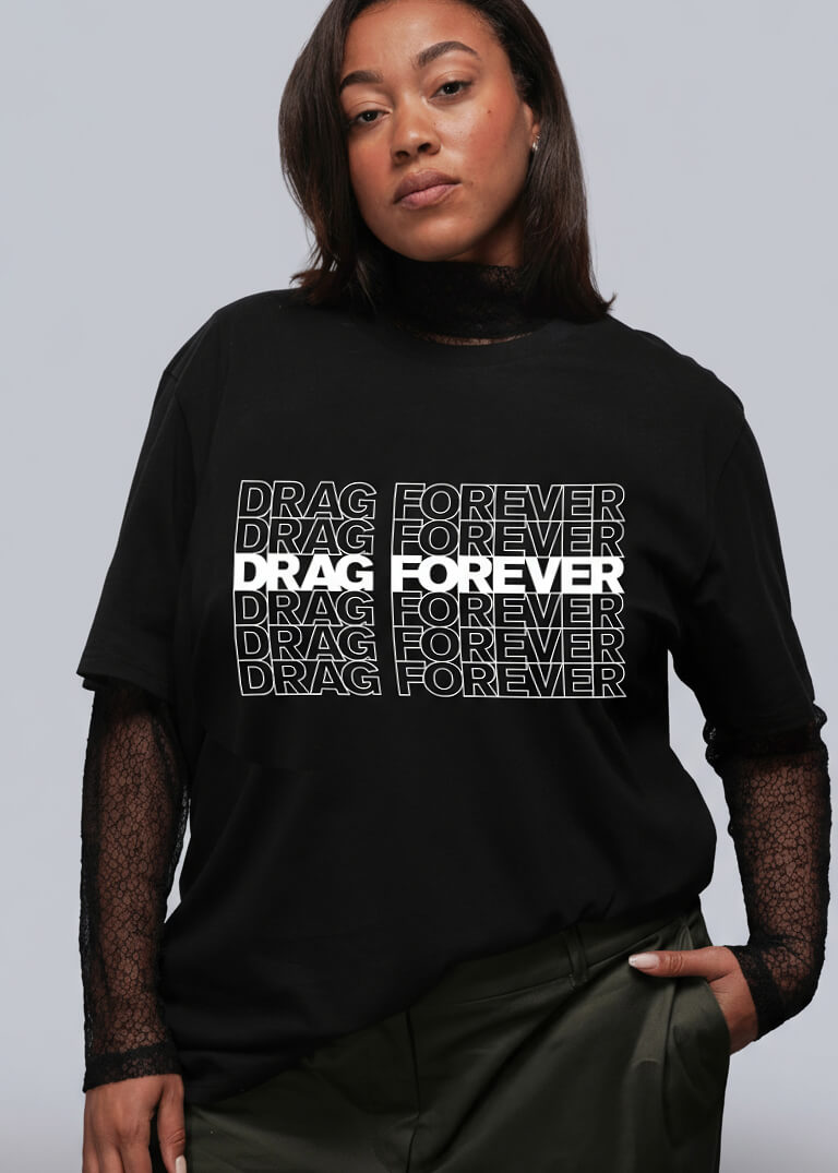 1X=Person wearing a black tshirt with 'DRAG FOREVER' text on a plain background