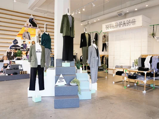 Store interior with mannequins wearing clothing and 'WILDFANG' branding.