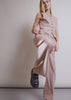 A model wearing The Empower Houndstooth Wide Leg Trouser and Vest shows the fit and features of the product including pockets and stretch