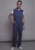 Model shows the fit and features of The Juliette Lewis X Wildfang Denim Sleeveless Coverall