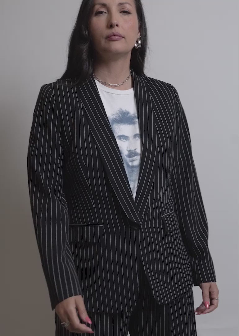 Two models of different sizes showcase the fit and features of The Empower Tux Pinstripe Blazer