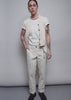 Model shows the fit and features of The Essential Trouser in Oat.