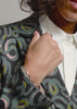 Video showing The Empower Double Breasted Blazer in snake Serpentine print.Video shows product on 3 different sized models showcasing each unique feature of the product including double breasted closure, stretch, soft material, ad deep pockets.