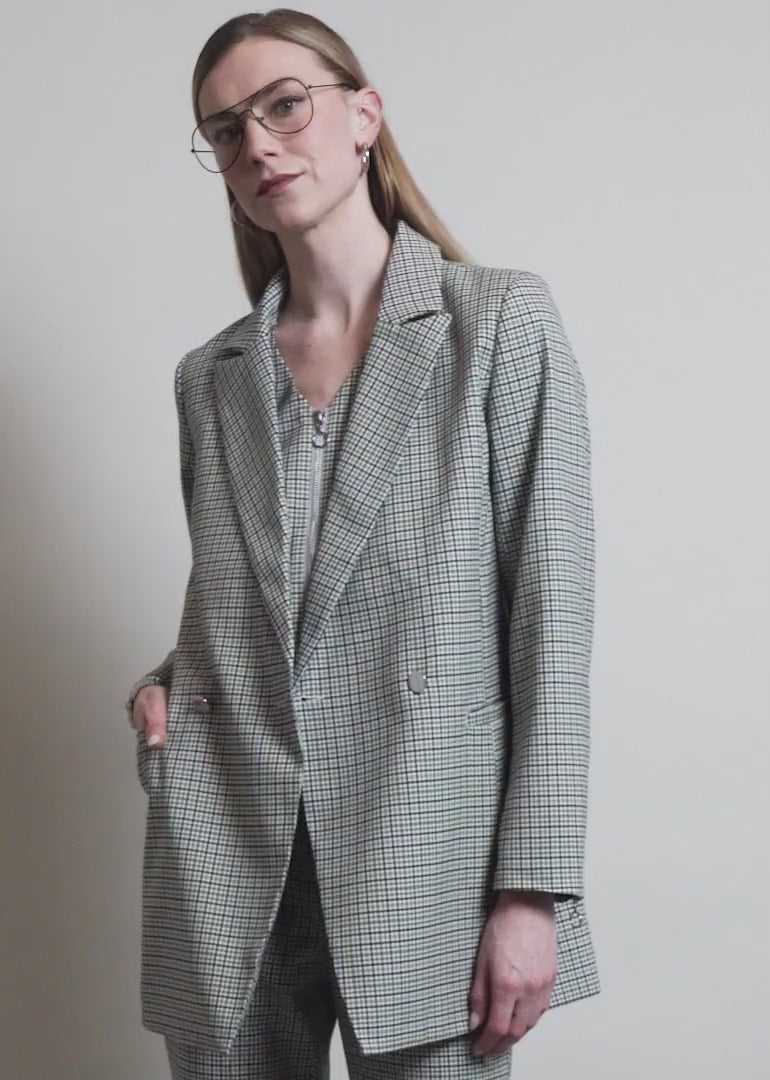 Model showing the fit and features of The Empower Zipper Double Breasted Blazer
