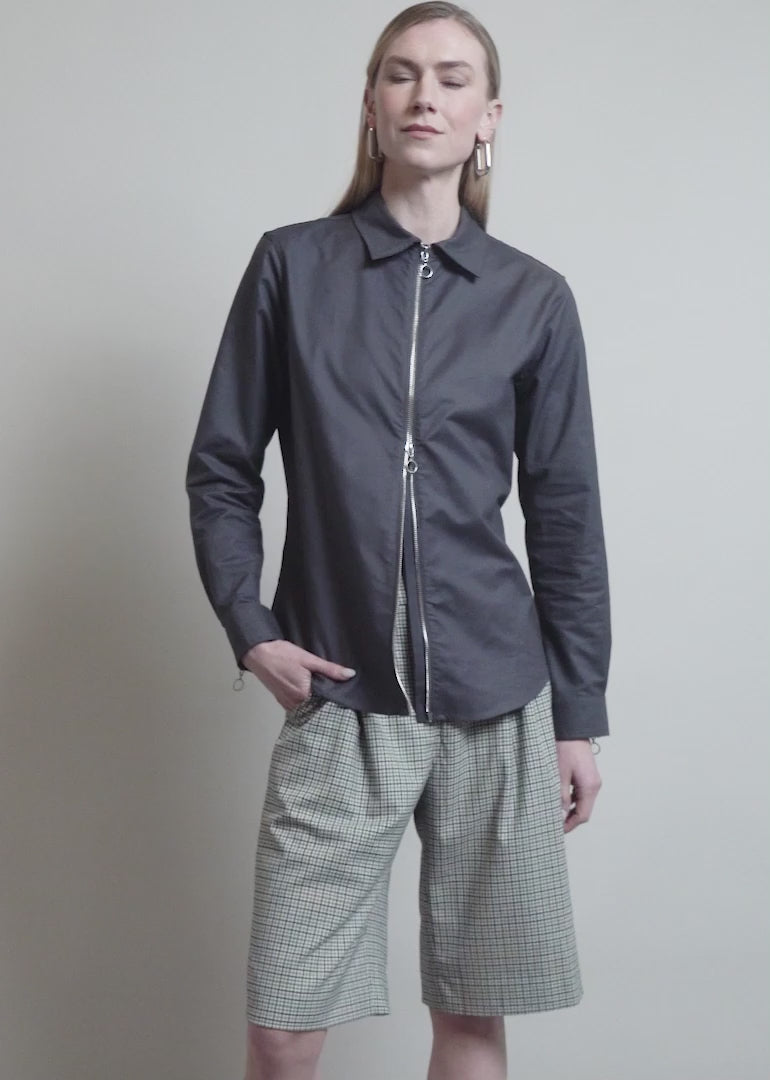 Model showing the fit and features of The Essential Oxford Zip Up Shirt 